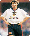 Roy Keane models the 1996 white Manchester United away kit